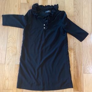 Ruffle neck black sheath.